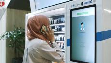 A patient in a teleconsultation with a pharmacist via PharmaSis vending machine