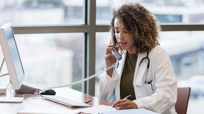 Doctor on the phone Photo by SDI Productions/Getty Images
