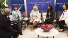 Dr. Monica Bertagnolli speaks as, from left, Dr. Alan Ashworth, Dr. Paola Bentancur, First Lady Dr. Jill Biden, medical student Kami Pullakhandam and Dr. Rita Mukhtar