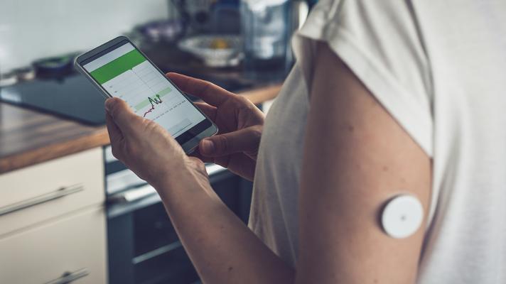 Patient with remote monitoring sensor at home