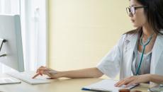 A doctor preparing for a virtual consultation
