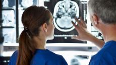 Healthcare workers looking at an X-ray