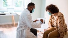 Patient speaks with her doctor about treatment plan