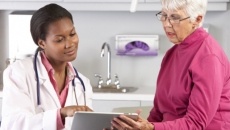 Doctor and patient with tablet