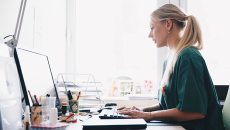A nurse sitting at a computer